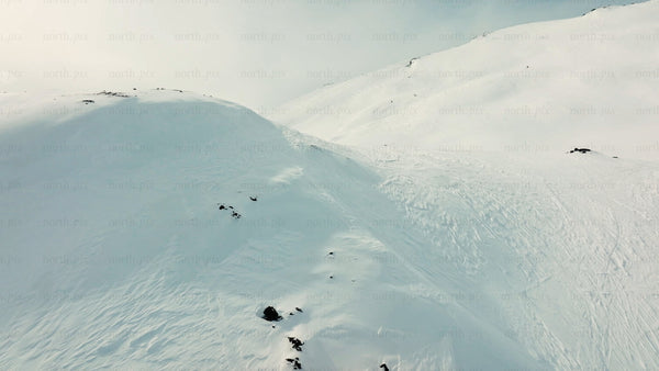 Snowy mountain landscape in riksgransen, Sweden - aerial drone view