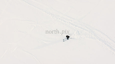 Aerial View of Skiing Downhill on Snowy Slope in Riksgransen