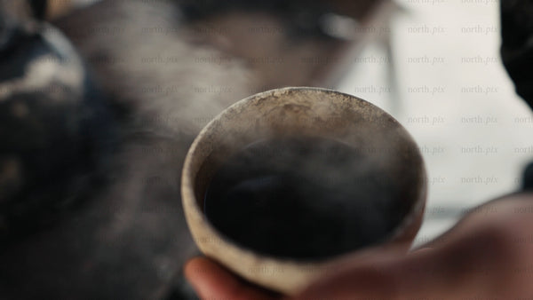 Steaming cup of coffee on a winter day in Luleå