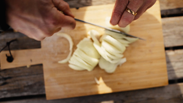 Chopping onions outdoors in winter