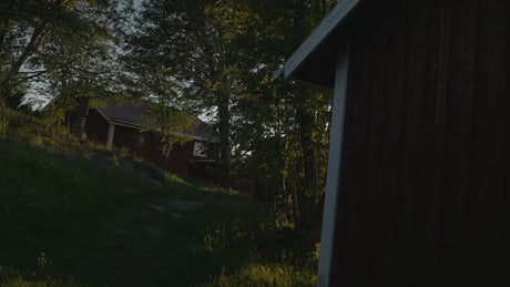 Summer Evening in Luleå Archipelago: Red Cabin by the Water