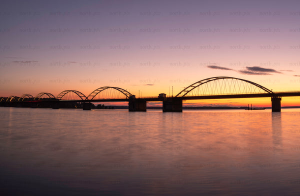 Bergnäsbron arched bridge at sunset over river