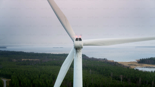 Wind turbine spinning: Clean energy in a scenic landscape