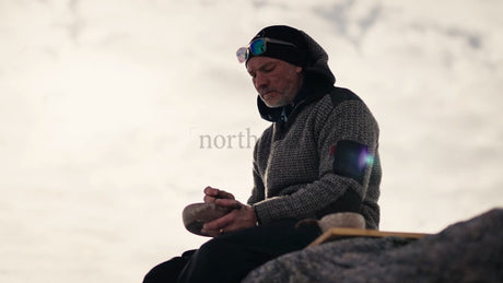 Man Enjoys Warm Drink from Kuksa in Wintery Luleå Archipelago