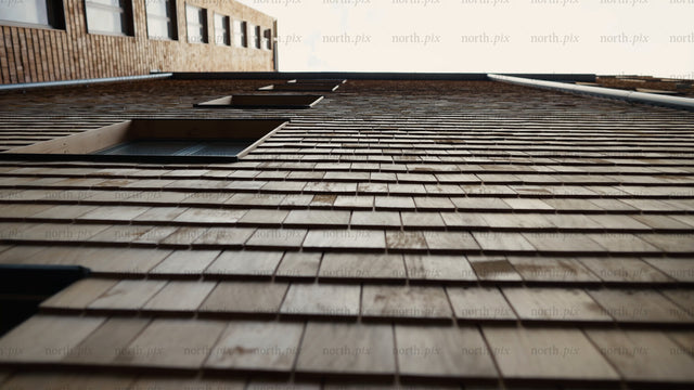 Modern wood building facade: Low angle tilt revealing architectural details and texture