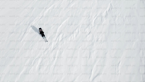 Skier on a snowy slope: Winter sports adventure
