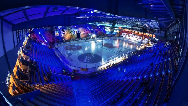Timelapse of a hockey game in a packed arena with cheering fans