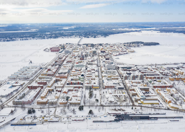Winter drone view of Luleå's cityscape and surrounding snowy landscape