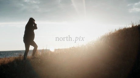 Silhouette Walking Up Hill During Golden Hour in Luleå, Sweden