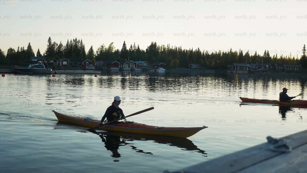 Kayaking in the Luleå archipelago at sunset during summer