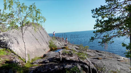 Summer Exploration in Luleå Archipelago: Group on Rocky Coast