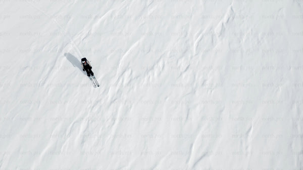 Skier on a snowy slope: Winter sports adventure