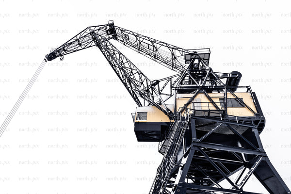Low-angle view of an industrial harbor crane