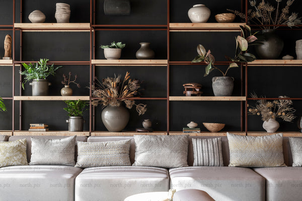 Sofa and open shelving with vases and plants, interior