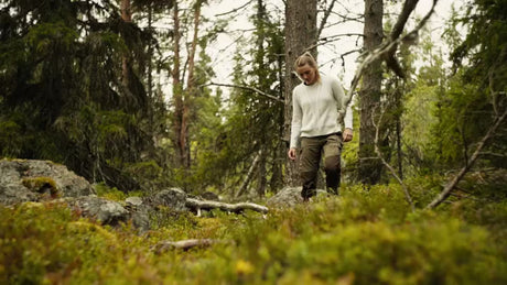 Woman Picking Berries in Lulea Archipelago Forest on a Cloudy Summer Day