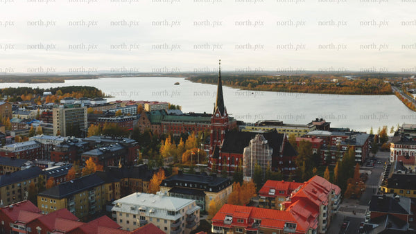 Aerial view of Luleå in autumn: Colorful foliage and Luleå cathedral