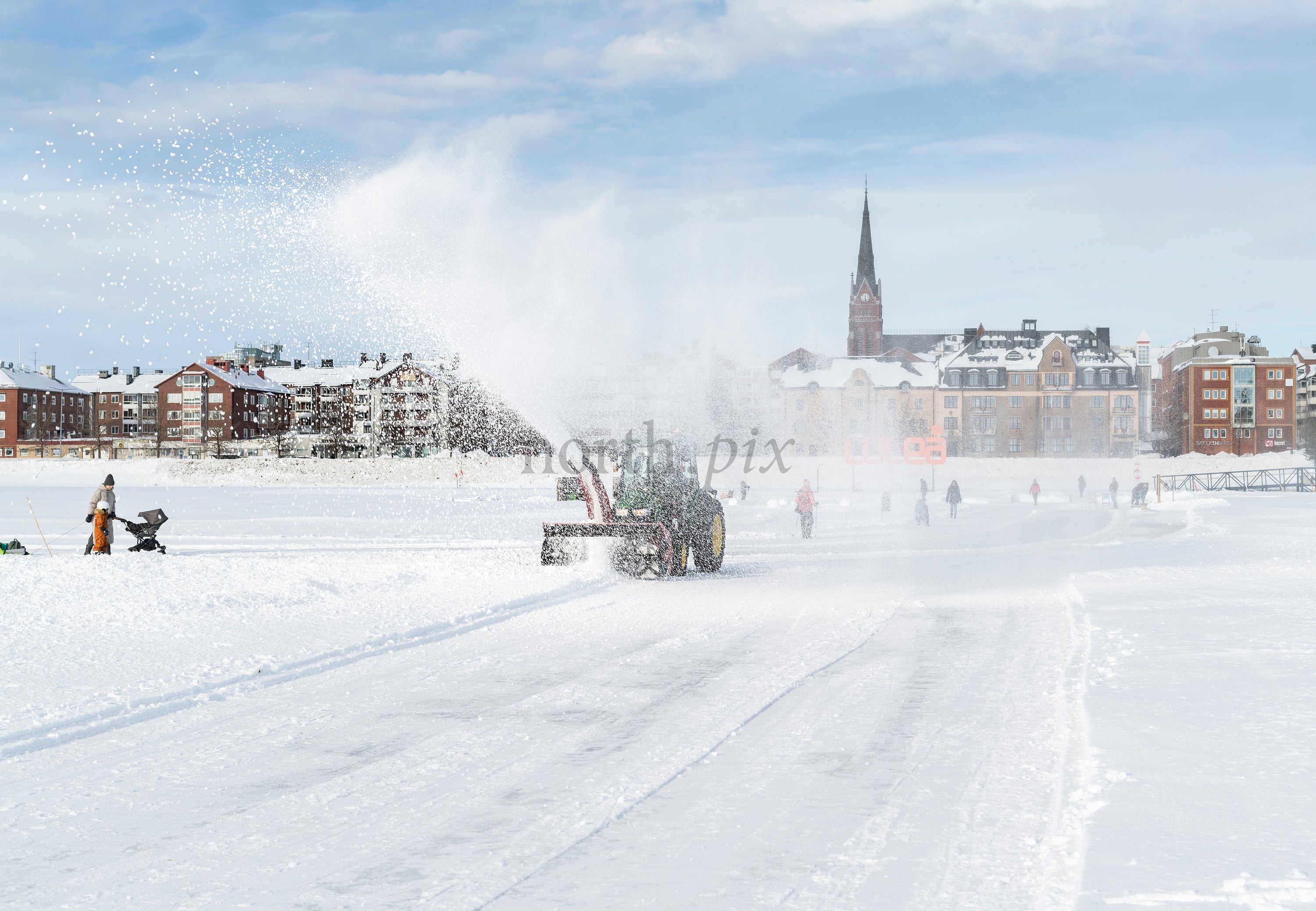 Tractor snow plow on frozen sea ice, Luleå winter