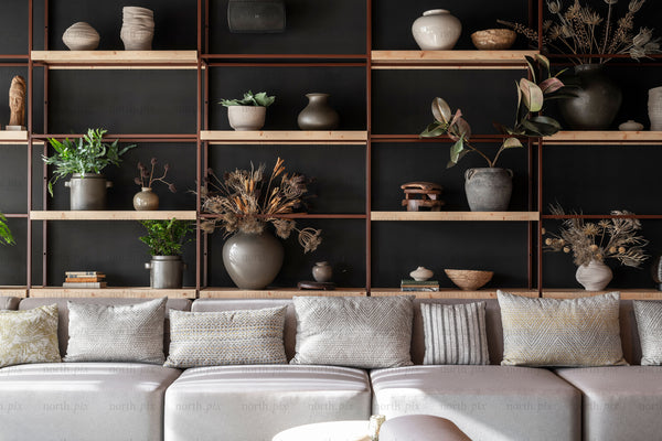 Sofa and open shelving with vases and plants, interior