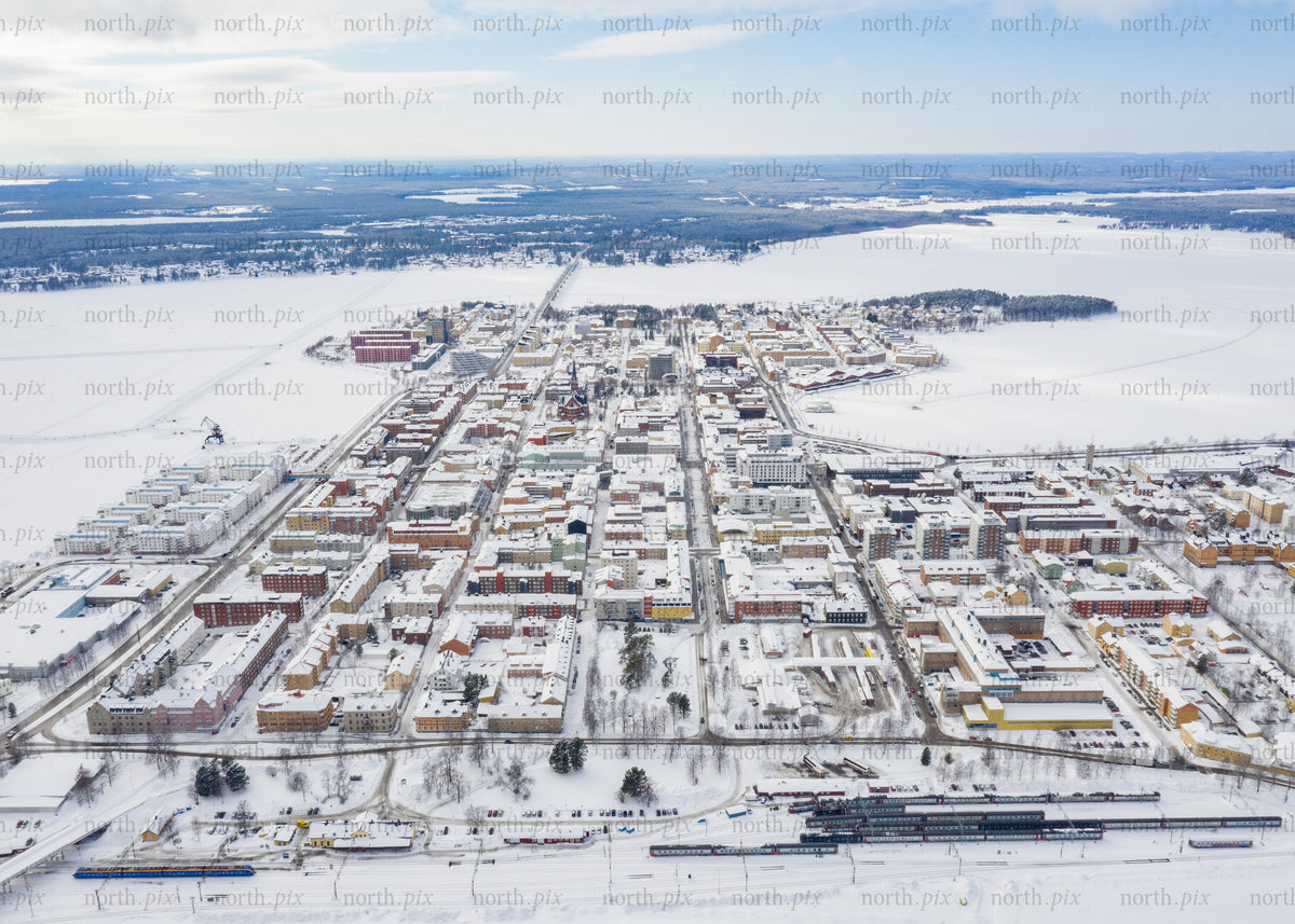 Winter drone view of Luleå's cityscape and surrounding snowy landscape