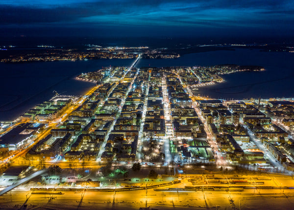 Aerial night view of Luleå cityscape during winter season in blue hour