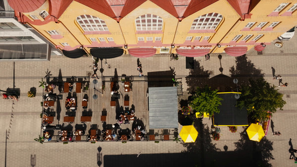 Summer in Luleå: Aerial view of city street, outdoor restaurant, and pedestrians