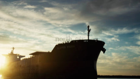 Cargo Ship Silhouette at Sunset in Luleå, Sweden