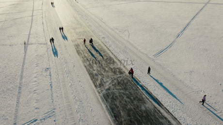 Aerial View of People Enjoying a Frozen Road in Winter Luleå