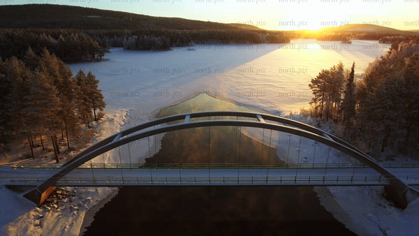 Winter sunrise over a bridge in Gunnarsbyn