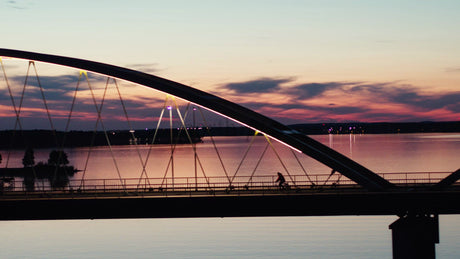 Sunset Bike Ride Over Lulea River: A Tranquil Summer Evening in Sweden