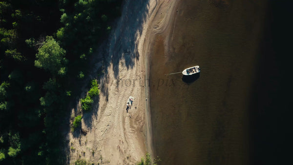 Summer Day in Luleå Archipelago: Aerial View of Beach, Boat, and People