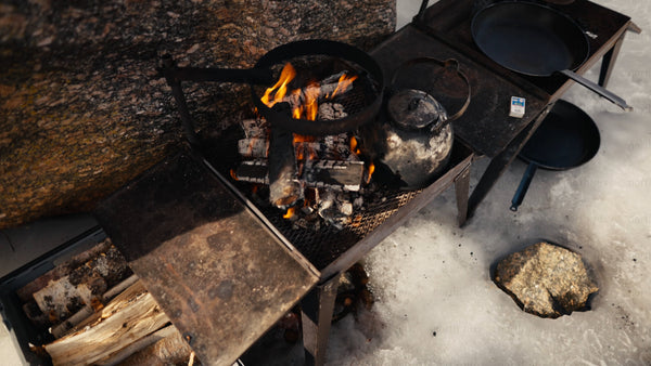 Winter campfire cooking with marshmallows in Luleå archipelago