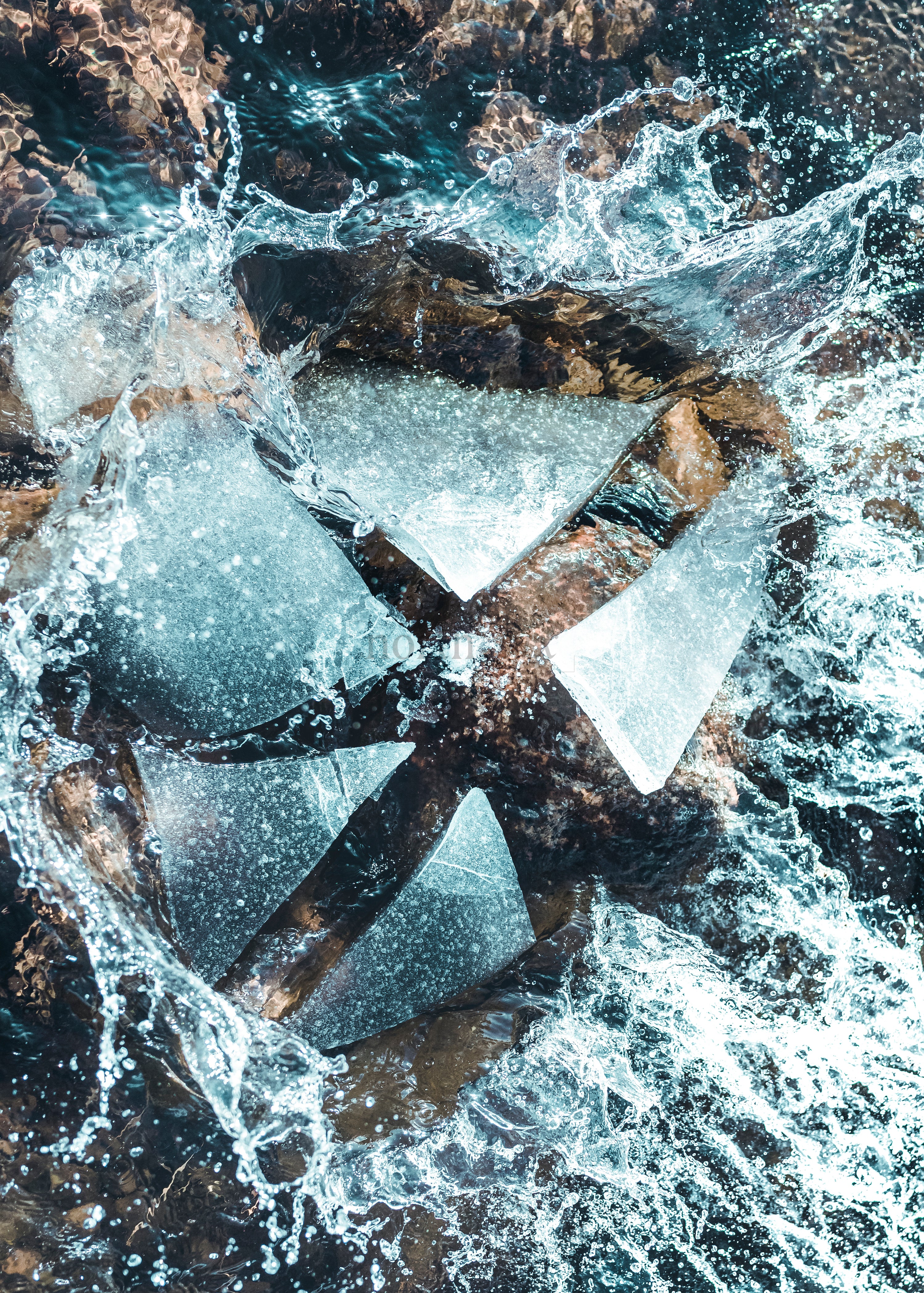 Close-up of metal water wheel with splashing water