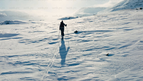 Person skiing in riksgransen, Sweden during winter
