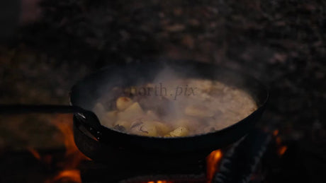 Cooking Meat and Potatoes Over an Open Fire in Winter, Luleå Archipelago, Sweden