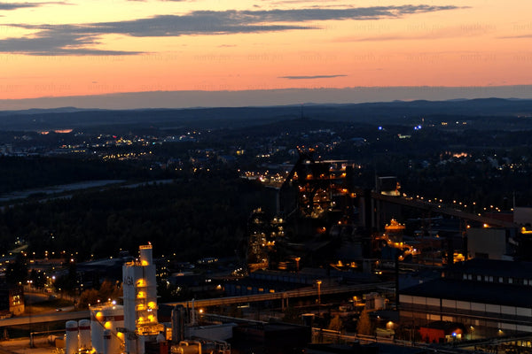 Industrial plant at sunset over Luleå city center: Nighttime Lights and industrial skyline