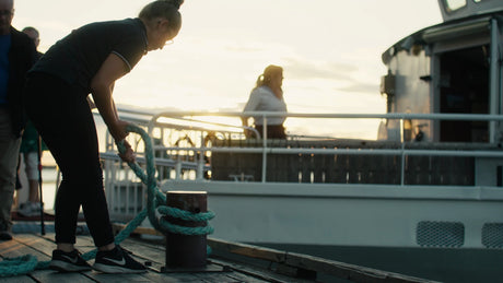 Mooring a Boat in Lulea: A Golden Hour Scene at the Pier