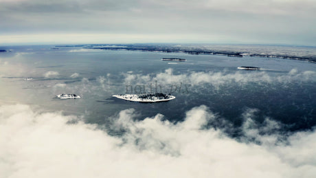 Stunning Aerial View of Piteå Haraholmen Archipelago in Winter with Snowy Islands and Icy Waters