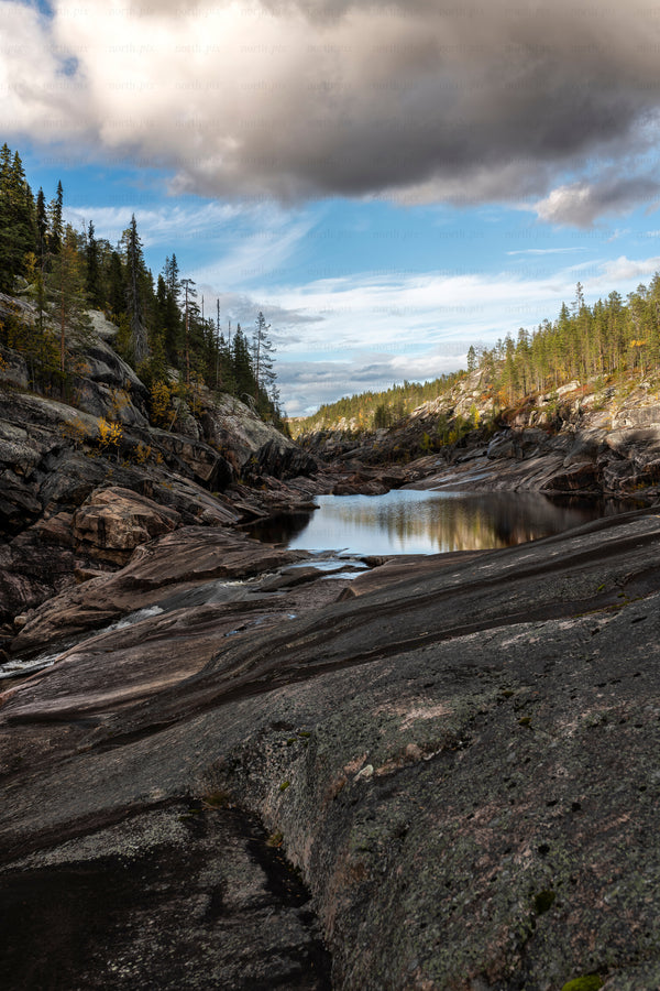 Jokkmokk - rocky river gorge with pine forest and pool