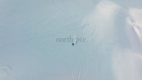 Skiing in Riksgränsen: Aerial View of Winter Sports on Snowy Mountain Slope