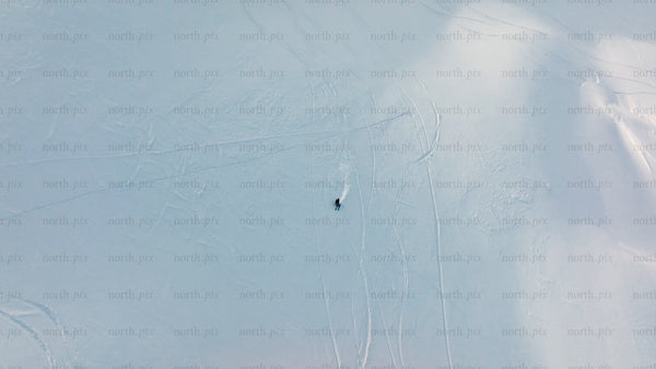 Skiing in Riksgränsen: Aerial view of winter sports on snowy mountain slope