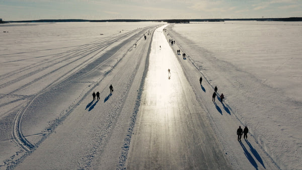 Ice skating and walking on a frozen lake in Luleå, on a winter day