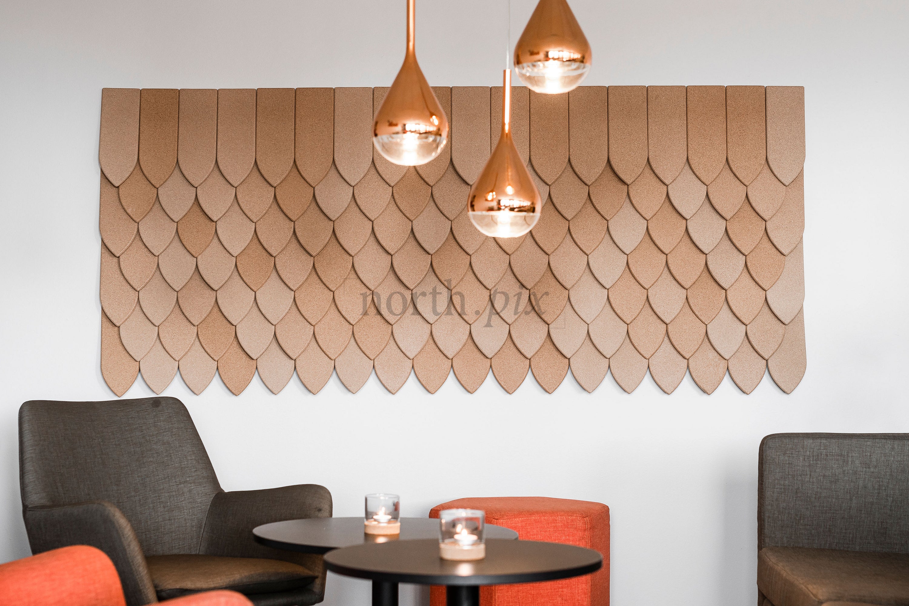Lounge seating with decorative wall panels and pendant lights