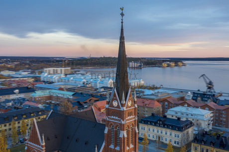 Aerial View Of Luleå City Center With A Clock Tower Spire Over Waterfront And Colorful Roofs