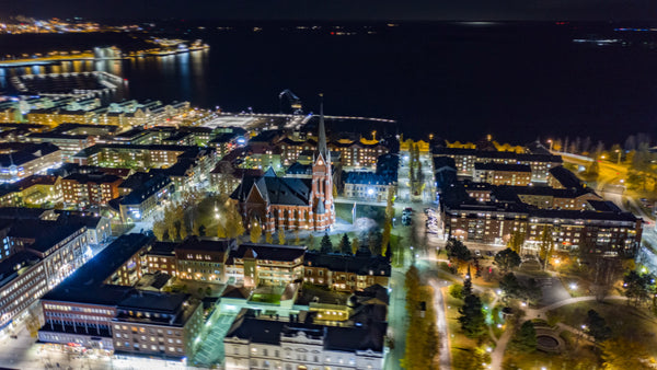 Aerial hyperlapse of Luleå city center at night: Luleå cathedral and Norrbotten county