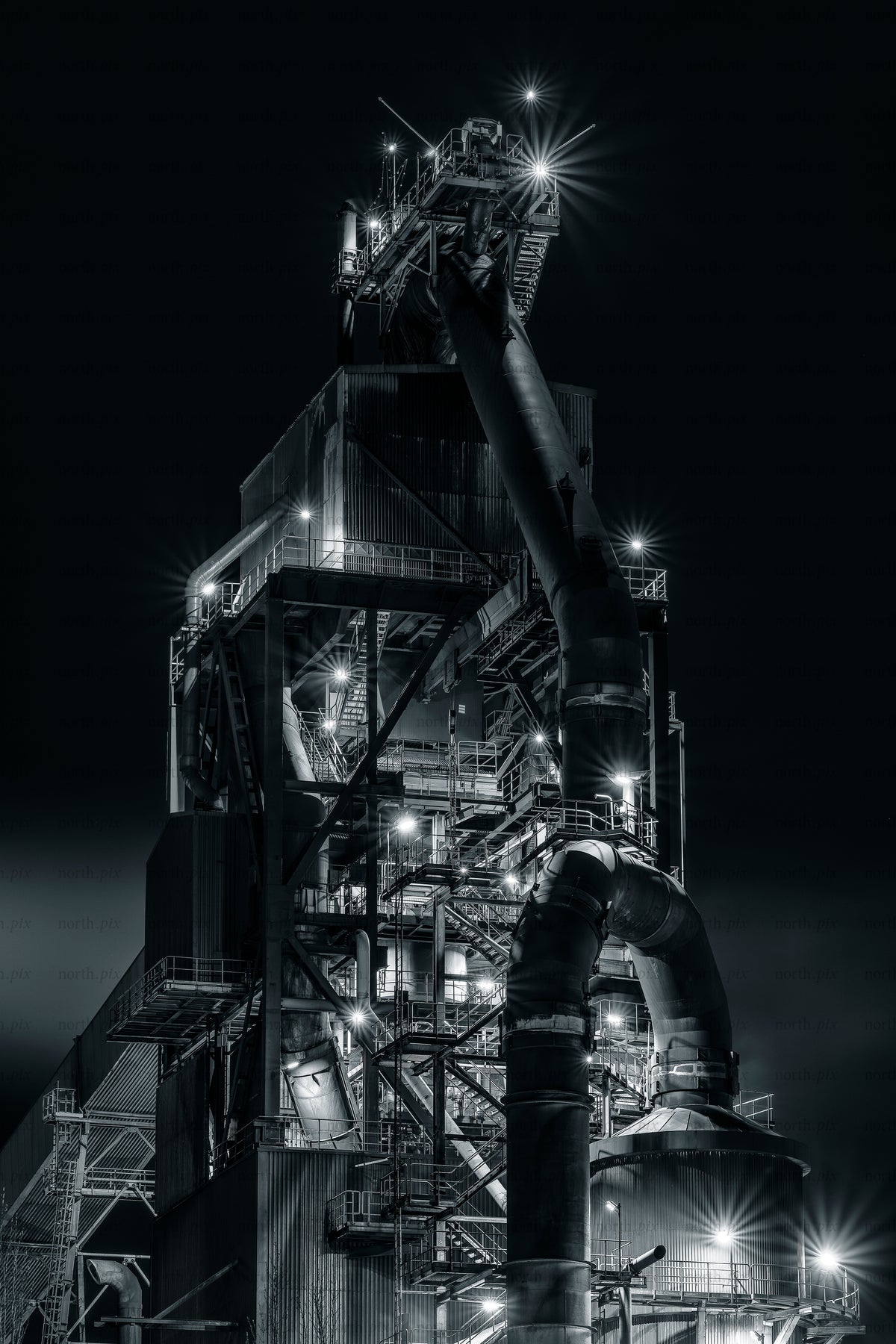 SSAB industrial plant structure with large pipes at night