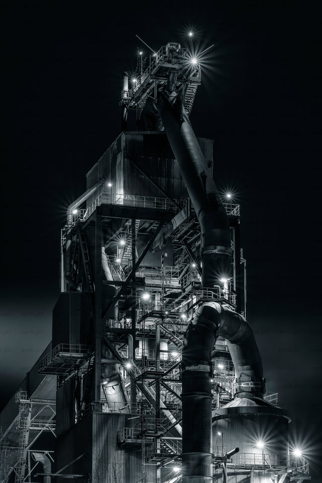 SSAB industrial plant structure with large pipes at night