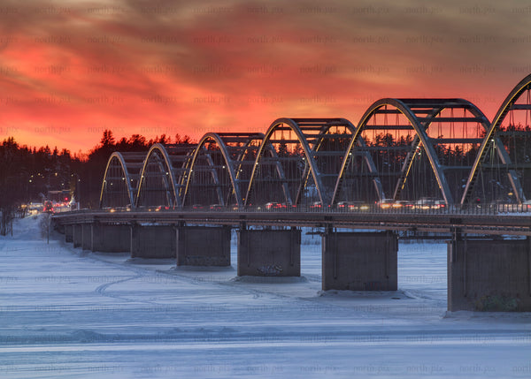 Arched road bridge at sunset in winter