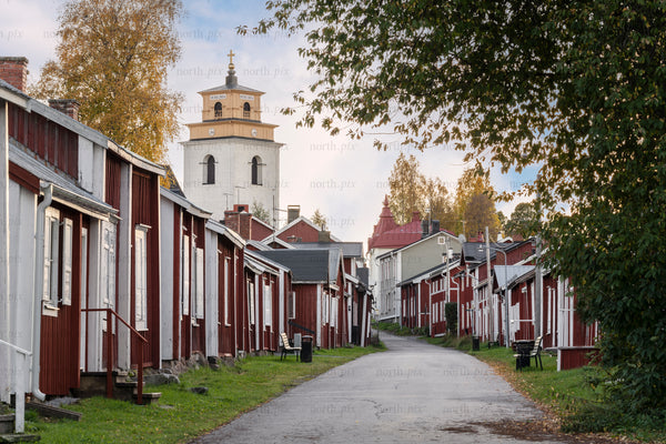 Narrow street of red wooden houses in Gammelstad, church town