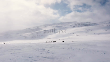 Skiing in Riksgränsen: Group on Winter Adventure in Snowy Mountains