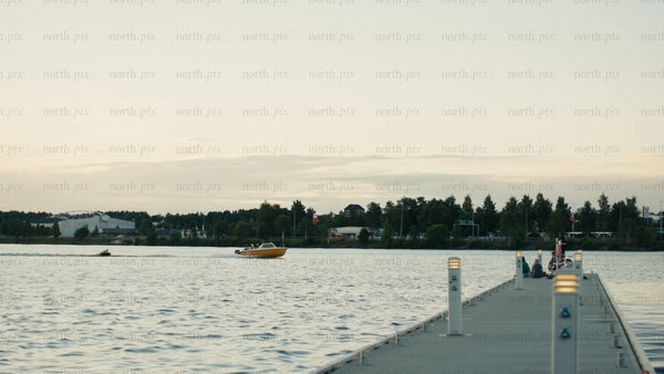Luleå: Evening view from pier with speedboat in summer